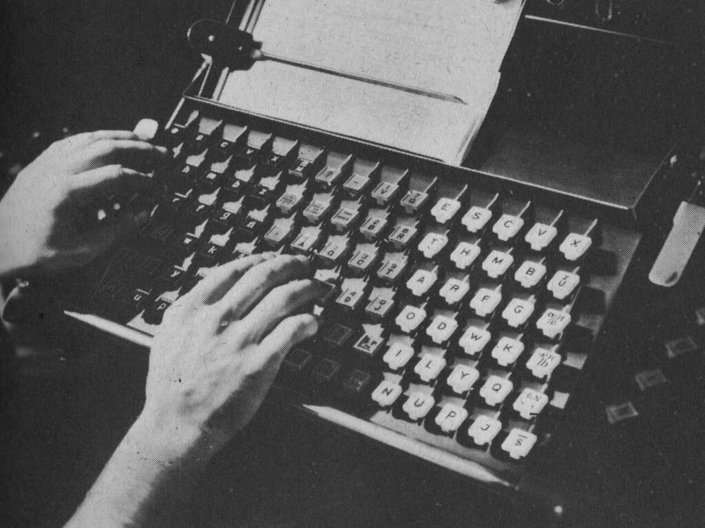Hands on a typewriting machine. The Form of the Book